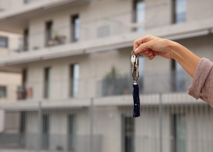 hand-holding-keys-outdoors